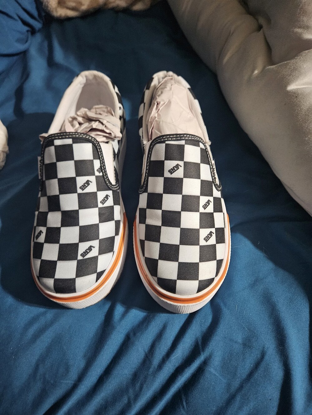 Vans Black & White Checkerboard Slip-Ons with Orange Trim